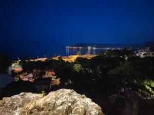 a view of a city from a mountain at night at Brilu in Savona