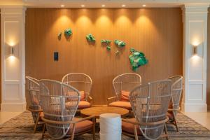 a meeting room with a table and chairs at Exclusive Kauai Beachfront Resort with Dining, Bar, Spa, Pool & Waterslide in Lihue