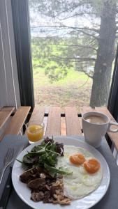 a plate of food on a table with a plate of food at Scrub n bush in Bohena Creek
