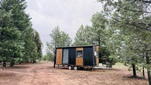 a tiny house on a trailer in a forest at Scrub n bush in Bohena Creek +27 photos
