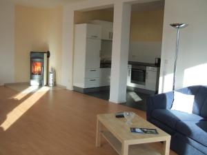 a living room with a couch and a coffee table at Ferienhaus Lutowsee in Grammertin +6 photos