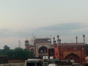 a large building with a gate in front of it at Hotel Raj Bed And Breakfast in Agra +10 photos