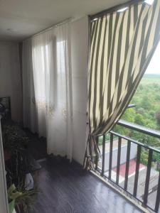 a room with a balcony with a window at Deako in Kobuleti