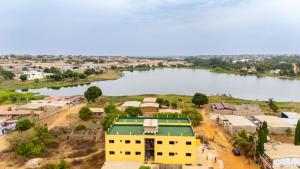 an aerial view of a village next to a river at BRUNCH RESIDENCE BoUAKE in Kodia Kofikro