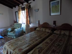 Giường trong phòng chung tại Posada La Ceña