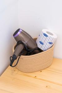 a hair dryer sitting on top of a wooden table at Casale Santa Rosalia Charme Villas and Rooms in San Mauro Cilento