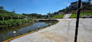 a body of water next to a river at Hame Lana Resort in Mawlynnong +6 photos