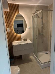 a bathroom with a sink and a shower and a toilet at Róża- Lotnisko in Wrocław +57 photos