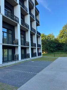 an empty parking lot in front of a building at Róża- Lotnisko in Wrocław