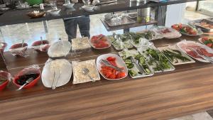 a buffet with plates of food on a table at Barış hotel in Alasehir