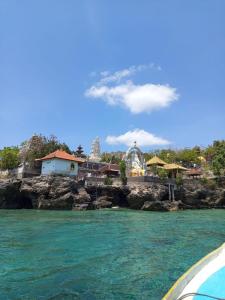 a view of a resort from the water at Taba Yama Trip & Homestay in Ketapang