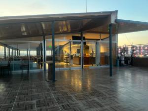 a large building with glass doors and a floor at Barış hotel in Alasehir