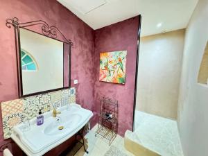 a bathroom with a sink and a shower at Les Roses de Montherlant in Montherlant