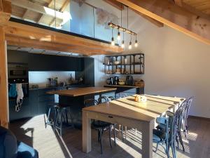 a dining room with wooden tables and chairs at Chalet Chante Guisane in Saint-Chaffrey