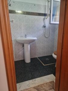 a bathroom with a sink and a toilet at Frangio' in Noci