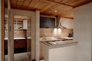 a kitchen with a sink and a counter at Das Filzmoos in Filzmoos +59 photos