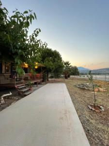 a walkway leading to a house on the beach at Seaside Garden Galaxidi in Galaxidi