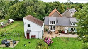an aerial view of a house with a yard at Le gîte des Allains in Sainte-Suzanne-en-Bauptois +7 photos