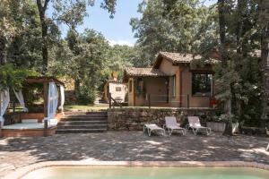 a house with two chairs and a pool at Landscape Villas - El Escondite De Pedro Malillo in Candeleda +3 photos