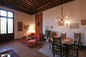 a living room with a couch and a table at Appartamenti Palazzo Foscarini . in Venice