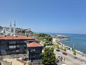 a view of the ocean from a building at KOÇAN OTEL Hatice Karakoçan in Akçakoca