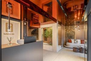 a living room with a couch and a table at PLATINUM hotel & spa in Sarajevo +65 photos