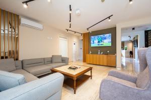 a living room with a couch and a table at Lamadu Residence in Sutomore