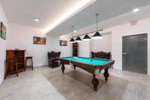 a living room with a pool table in it at Lamadu Residence in Sutomore
