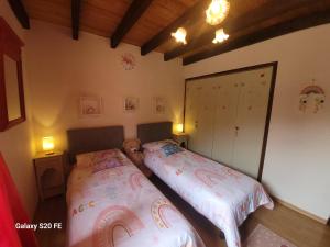 a bedroom with two beds and a closet at La symphonie des oiseaux in Villelongue-dʼAude +75 photos