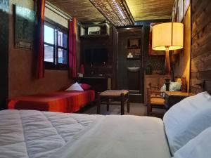 a bedroom with two beds and a table and a window at Antic house in Agadir +45 photos