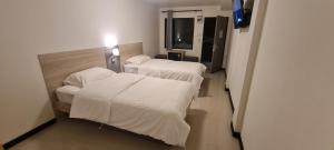 a hospital room with three beds and a television at ห้องพักรายวัน168 in Ban Amphaeng