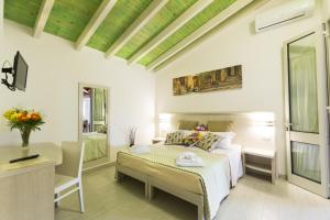 Postel nebo postele na pokoji v ubytování Agriturismo Il Megalite + 37 fotografií