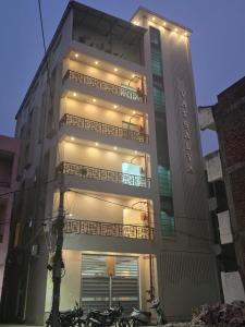 a tall building with motorcycles parked in front of it at Hotel Vatsalya by The Holy Meander in Varanasi