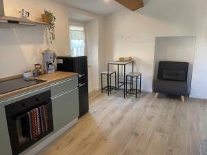 a kitchen with a sink and a stove top oven at SH Suite OLMO AC e Wi-Fi in Manziana