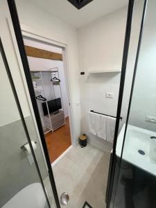 a bathroom with a shower and a sink at SH Suite OLMO AC e Wi-Fi in Manziana +10 photos