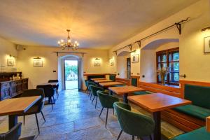 a row of tables and chairs in a restaurant at Boutique hotel Pod Barborou in Kutná Hora