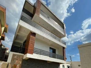 a modern house with a view of the sky at Appartements Rebero Hills in Kigali