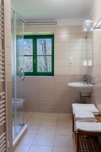 a bathroom with a sink and a shower at Chata Rozhlas in Železná Ruda +70 photos
