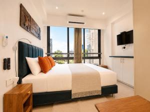 a bedroom with a large bed with a large window at SOLARIS APARTMENT-Sky Suites in Accra +52 photos