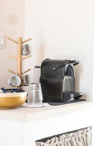 a microwave sitting on top of a counter at Masseria Voluzzi in Copertino