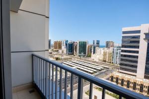 a balcony with a view of a city at Imperial Suites Hotel in Doha