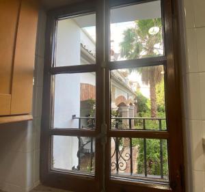 a window with a view of a balcony at Garden Suites Xativa Casa Rural in Xàtiva