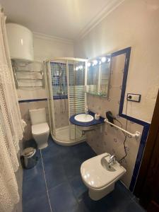a bathroom with a sink and a toilet and a mirror at Garden Suites Xativa Casa Rural in Xàtiva +48 photos