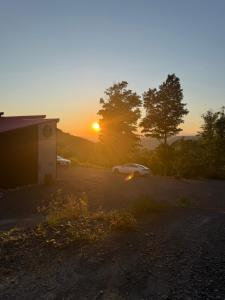 a car parked in a parking lot at sunset at Mytik Shack Sucré in Saint-René-de-Matane