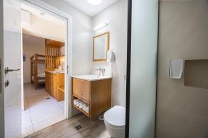 a bathroom with a toilet and a sink at SPNI Ein Gedi Field School in Ein Gedi +24 photos