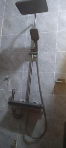 a microphone on a stand in a room at MVH Apartment - Chamber and hall unit in Sunyani