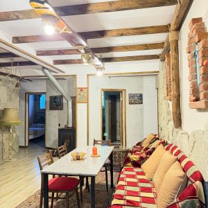 a living room with a couch and a table at HALI Guest Hause in Dilijan