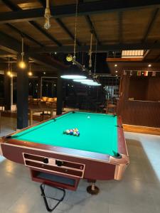 a pool table in a room with a pool table at Ivory Canopy Resort - Ella in Ella