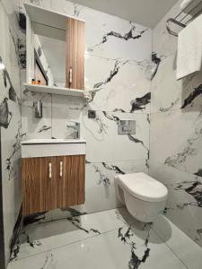 a bathroom with a toilet and a sink at Hisar Çeşme Hotel in Istanbul +66 photos
