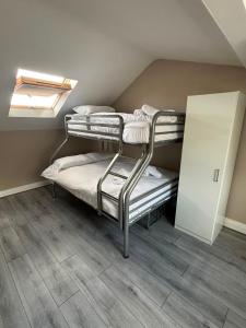 two bunk beds in a room with a skylight at Shamrock Quay in Cork